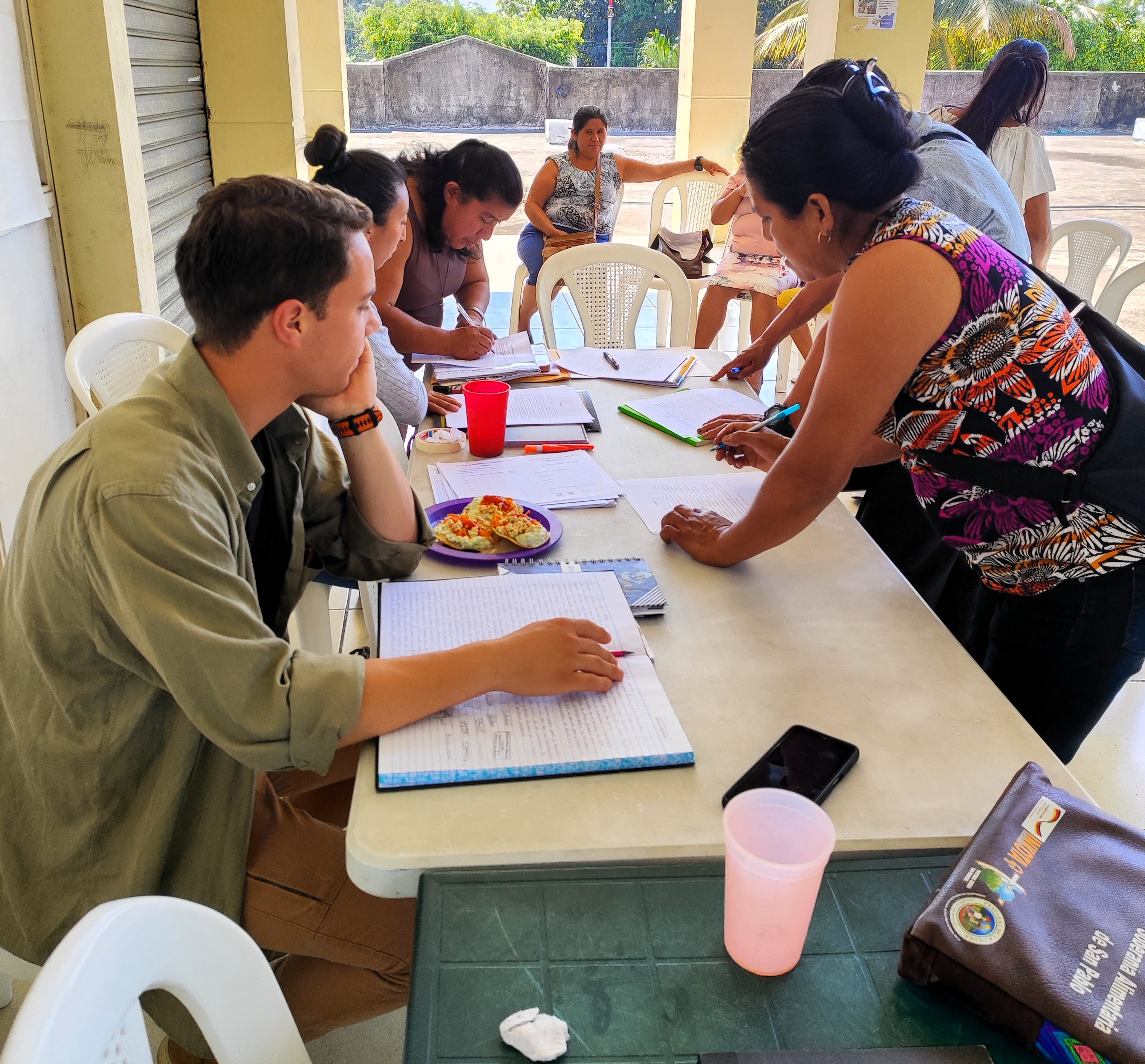 Workshop participants reviewing Agua Segura training materials